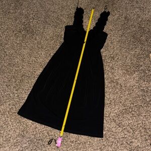 Black v neck dress with floral accent